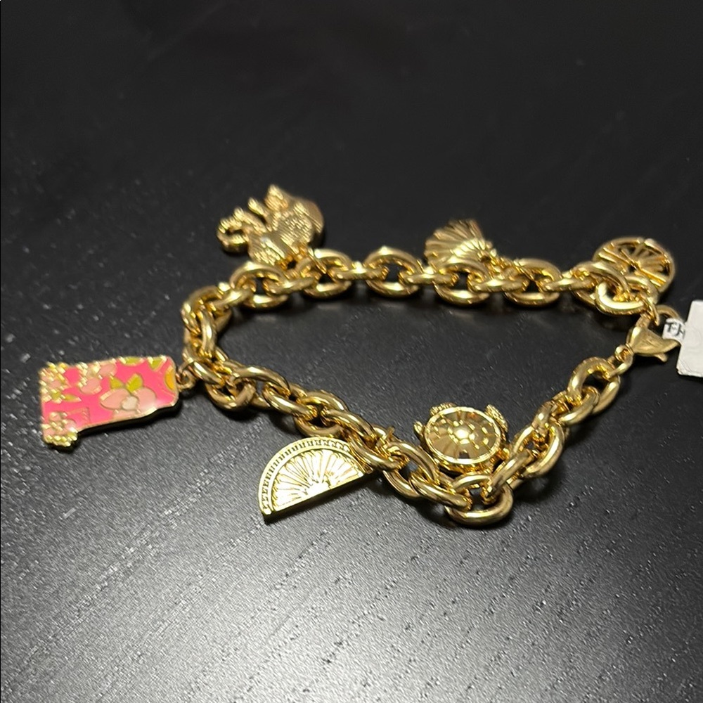 Lilly Pulitzer signature charm bracelet with shift dress charm .